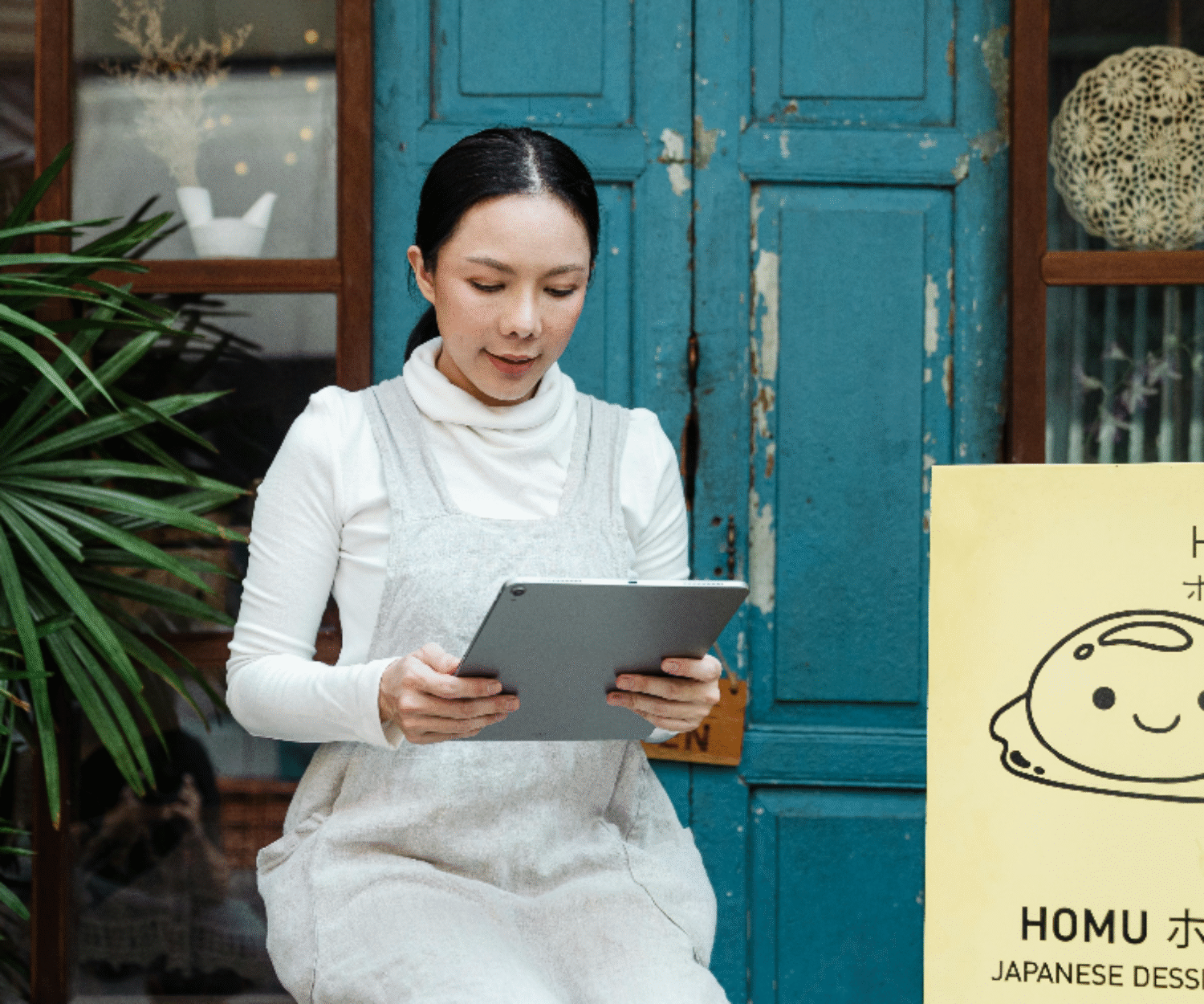 a person holding a tablet with a graph on the screen